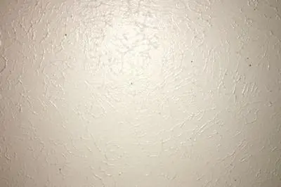 Small spots of mold growth on bathroom ceiling. 