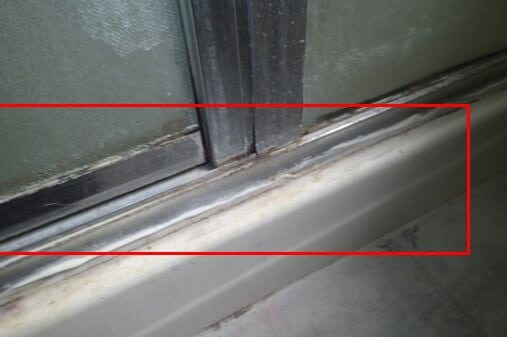 Mold growth on and in the bathroom is consistent with high humidity and moisture with a lack of ventilation.