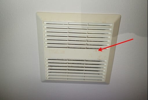 Water marks from condensation on hall bath fan indicating high humidity