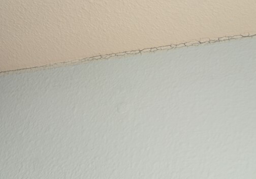 Paint cracking at joints indicating high humidity