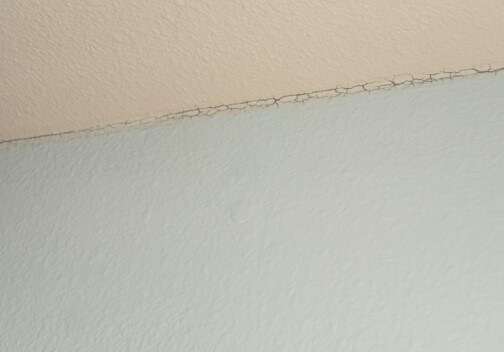 Paint cracking at joints indicating high humidity