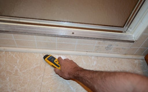 Elevated Moisture Noted In Front of Shower Stall