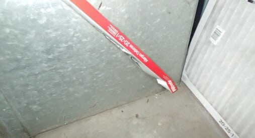 Furnace filter opening is a cut out of the side wall of the air return. This should be changed to its own compartment allowing a verified snug fit to an air filter. This is allowing the furnace to pull air from the unconditioned basement space and circulate it in the indoor environment.