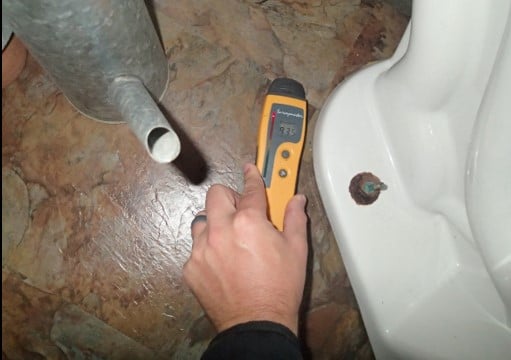 Possible toilet seal leak detected in bathroom