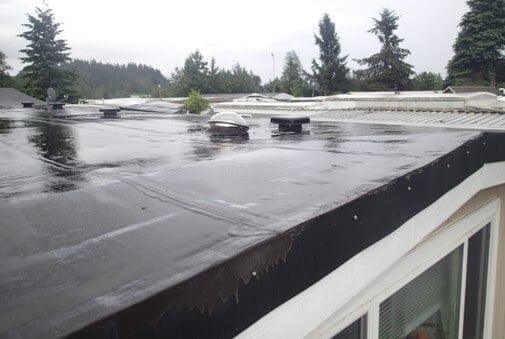 Newer torch down roof. Roof looks to be sealed well but may be lacking in ventilation.