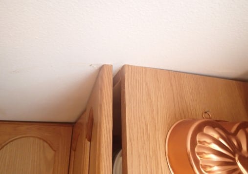 Kitchen cabinets are now inoperable due to ceiling failure.
