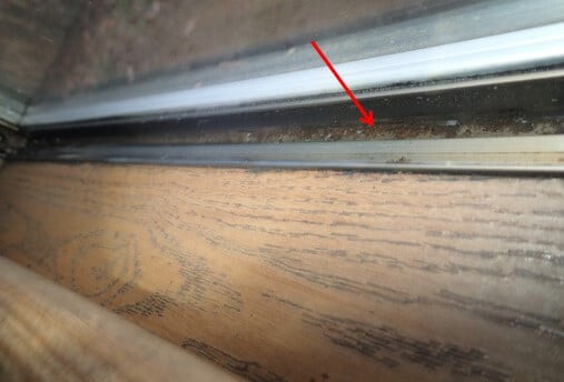 Window troughs have visible water from condensation running down window