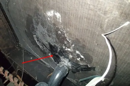 Belly wrap insulation in crawlspace shows signs of leak from above toilet seal