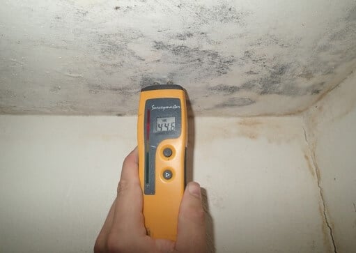 Elevated moisture detected in basement bathroom ceiling