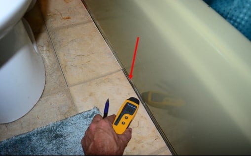 Elevated Moisture Noted Beside Tub – No Sealant Noted Between Floor And Tub