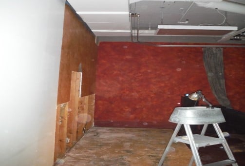Affected area of studio. Drywall and flooring removed.