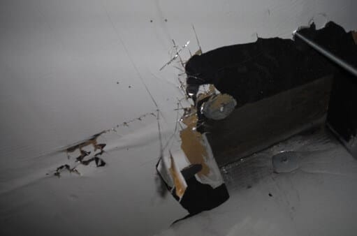 Ceiling material is foil-covered 2” foam board that has been painted white. All material is dry.