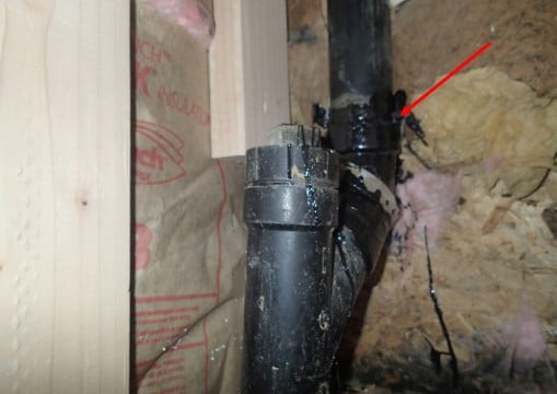 Kitchen drain with temporary fix on broken pipe fitting.