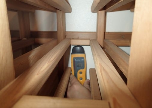 Wall is wet behind shelving, needs removal