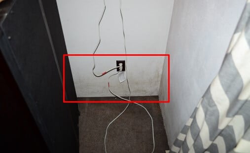 Mold Growth on Wall Behind Dresser – Corner Bedroom