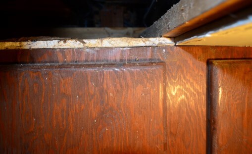 Water Damage Noted to Top of Laundry Cabinet