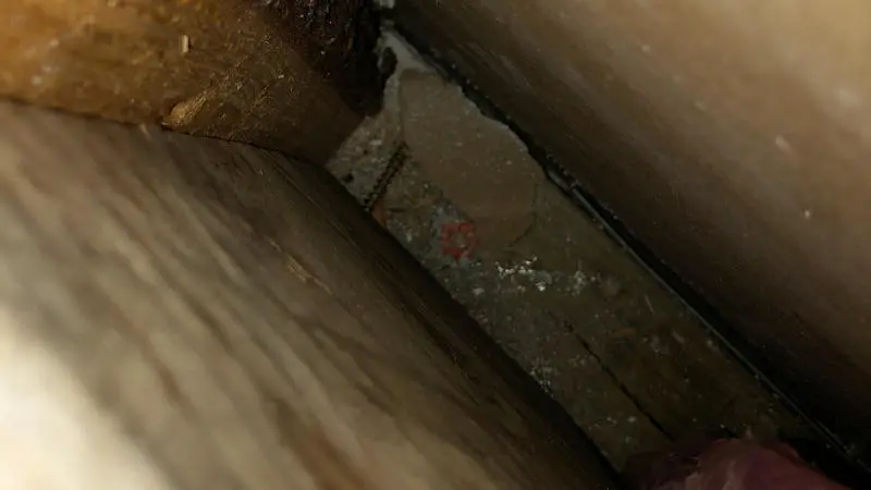 Mold testing in bathroom wall cavity.