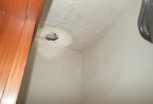 Water staining and plaster delamination occurring on closet ceiling
