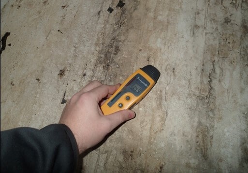 Standing water below bathroom