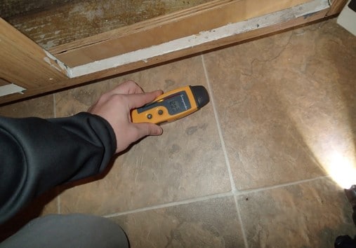 Slightly elevated moisture levels in flooring near kitchen sink cabinet