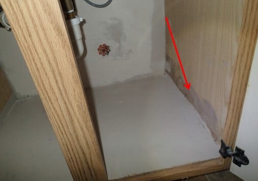 Water stains inside vanity from water wicking up